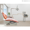 Silla dental de alta calidad con color naranja y taburetes de dentista